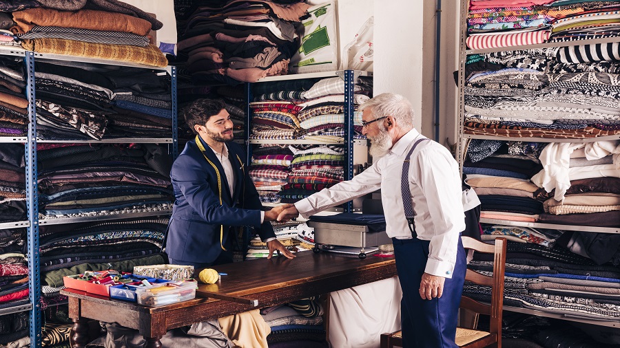 cloth business owner fixing the deal with client - start any business